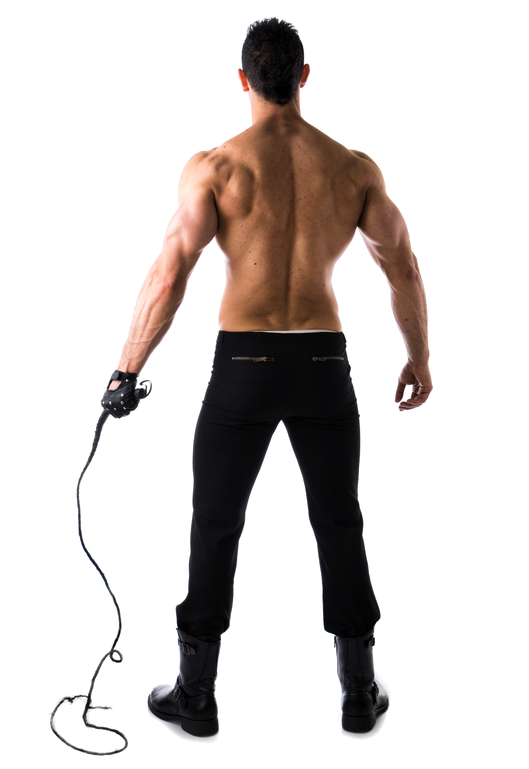 Rear view of a shirtless man in jeans, holding a single-tail whip/flogger